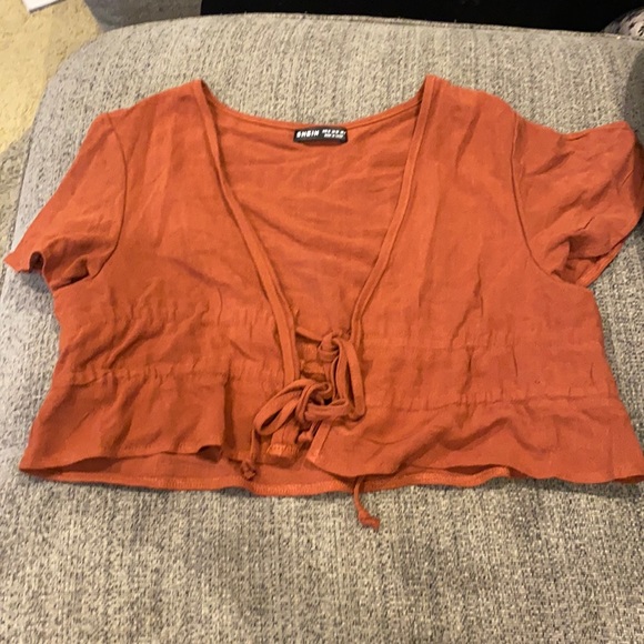 Blusa abierta color maron cono